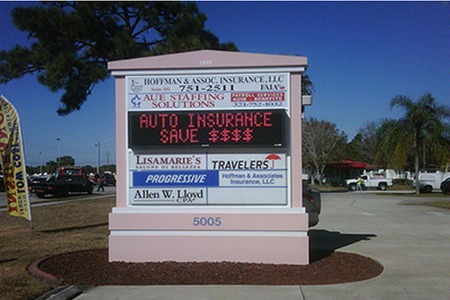 sign with AUTO INSURANCE SAVE $$$$ on the middle of it with lights